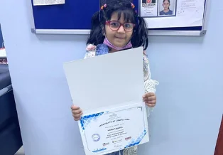 Brainy n Bright learner celebrating a learning milestone